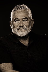 portrait photographer's sepia shot of senior man with beard