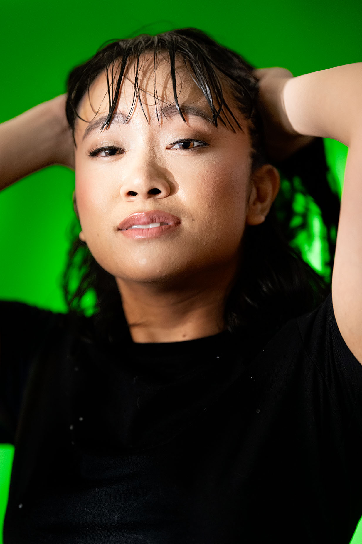 Portrait of Asian Girl with wet hair on greenscreen